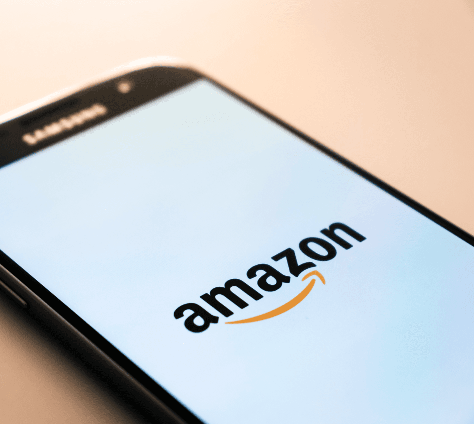 Close-up of a smartphone screen loading the Amazon app.