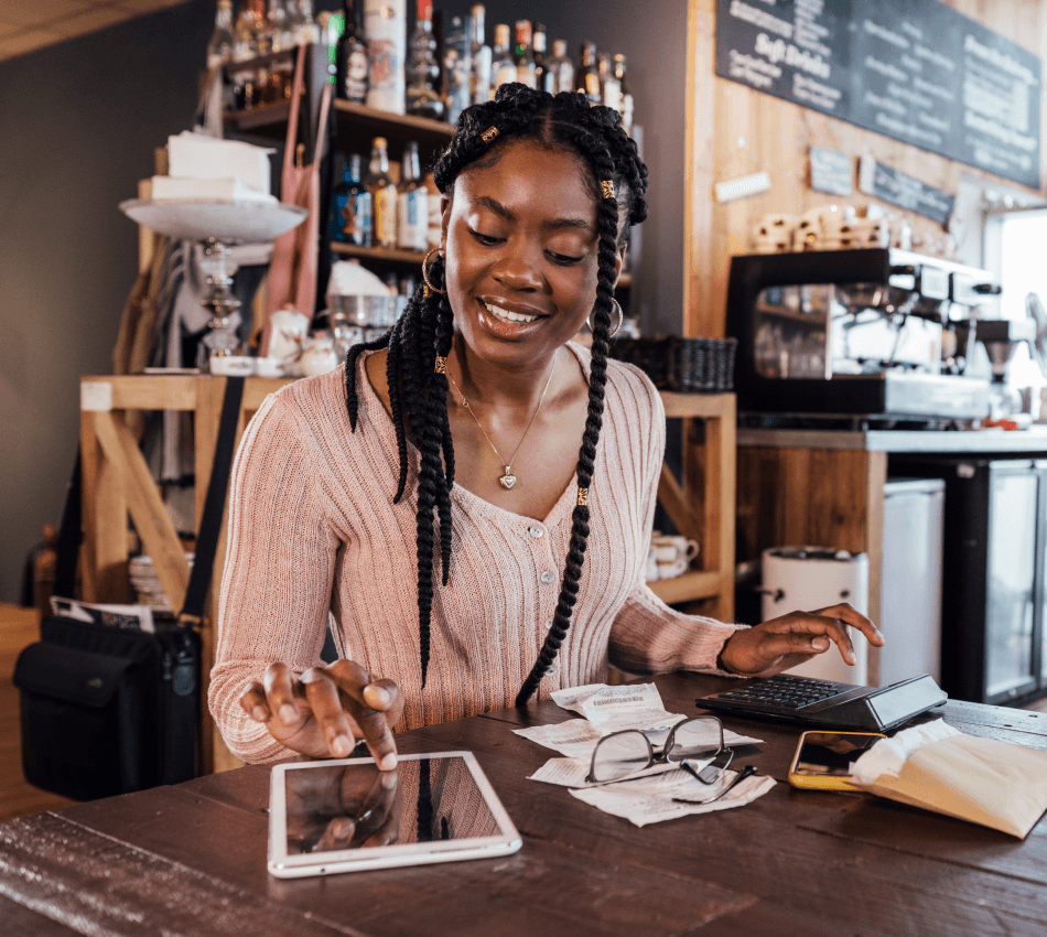Small business owner crunches numbers to forecast her company's cash flow for next quarter.